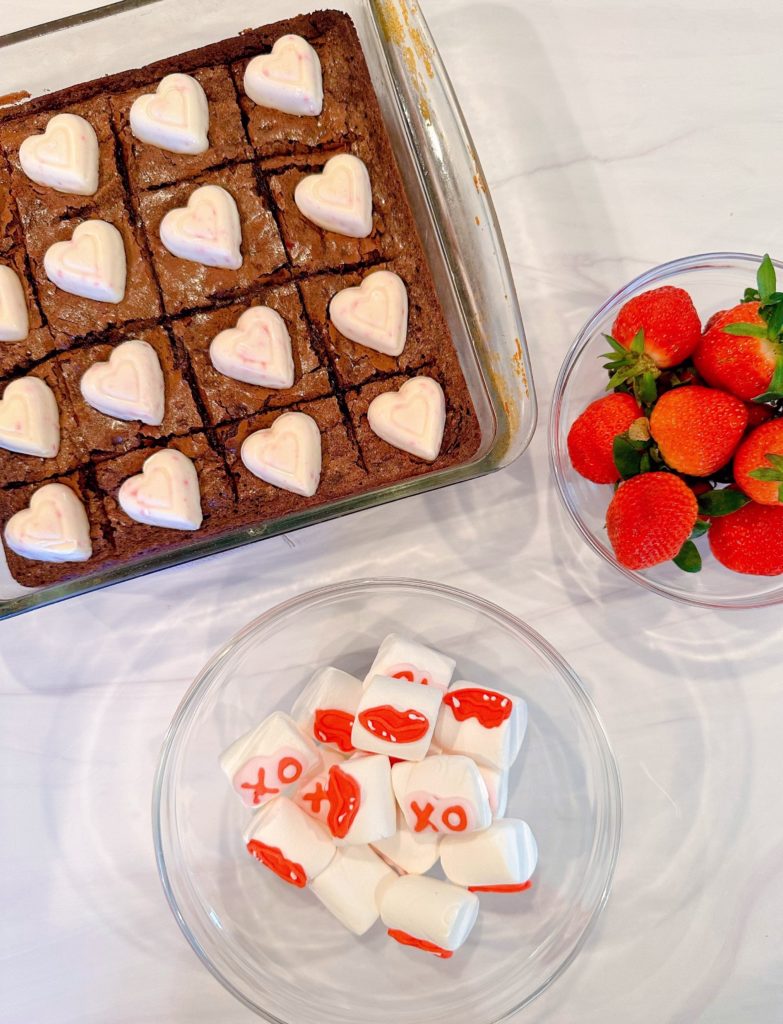 Ingredients for Brownie Strawberry Kabobs on table.