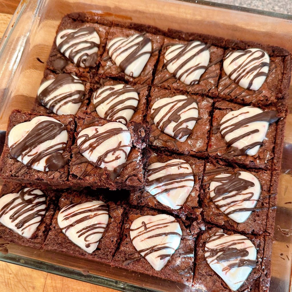 Removing cooled brownies to make strawberry chocolate kabobs.