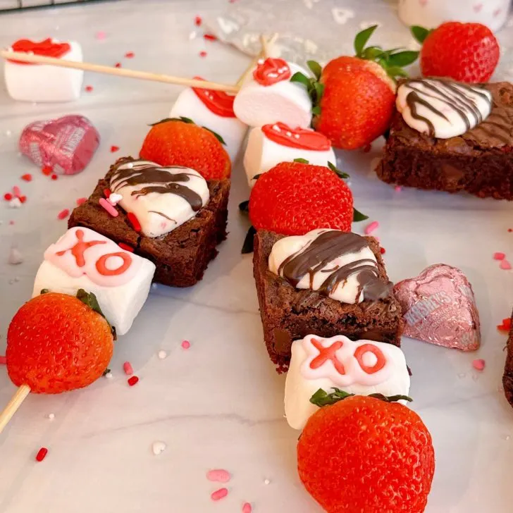 Strawberry Brownie kebabs on a counter close up.