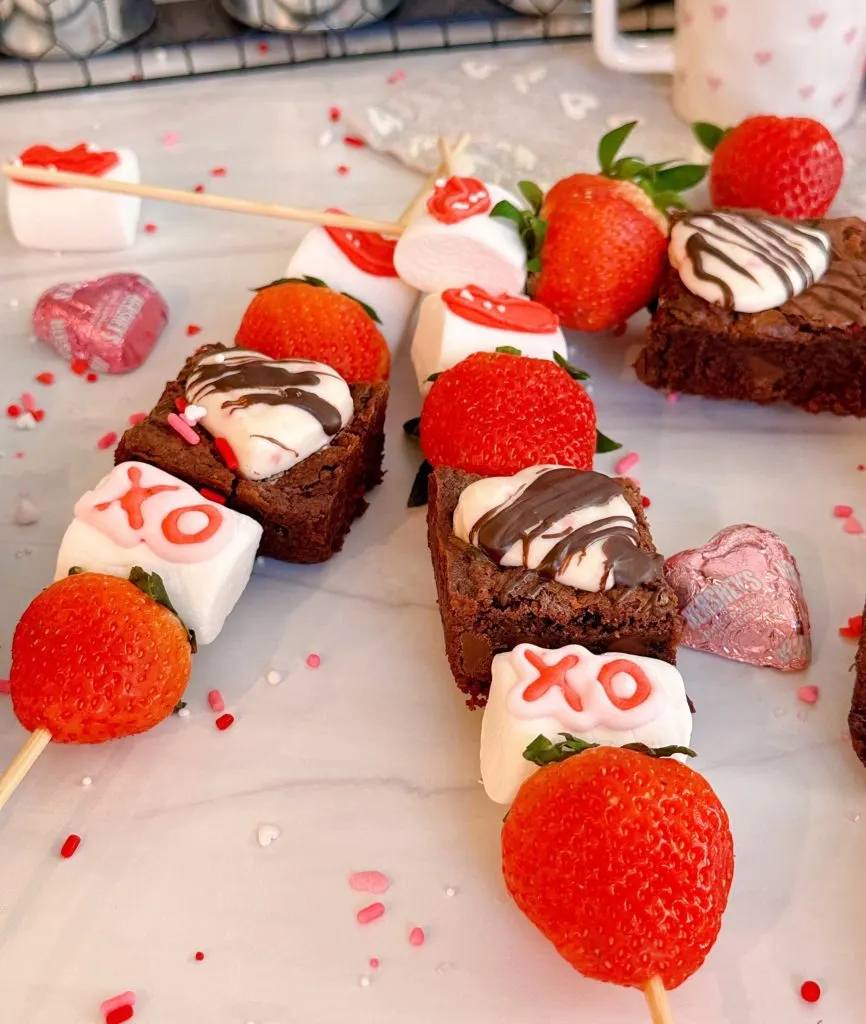 Strawberry Brownie kebabs on a counter close up.