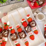 Strawberry Brownie Valentine Kabobs on a white platter.