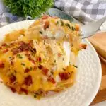 Easy Pierogi Casserole on a white dinner plate with a forkful!