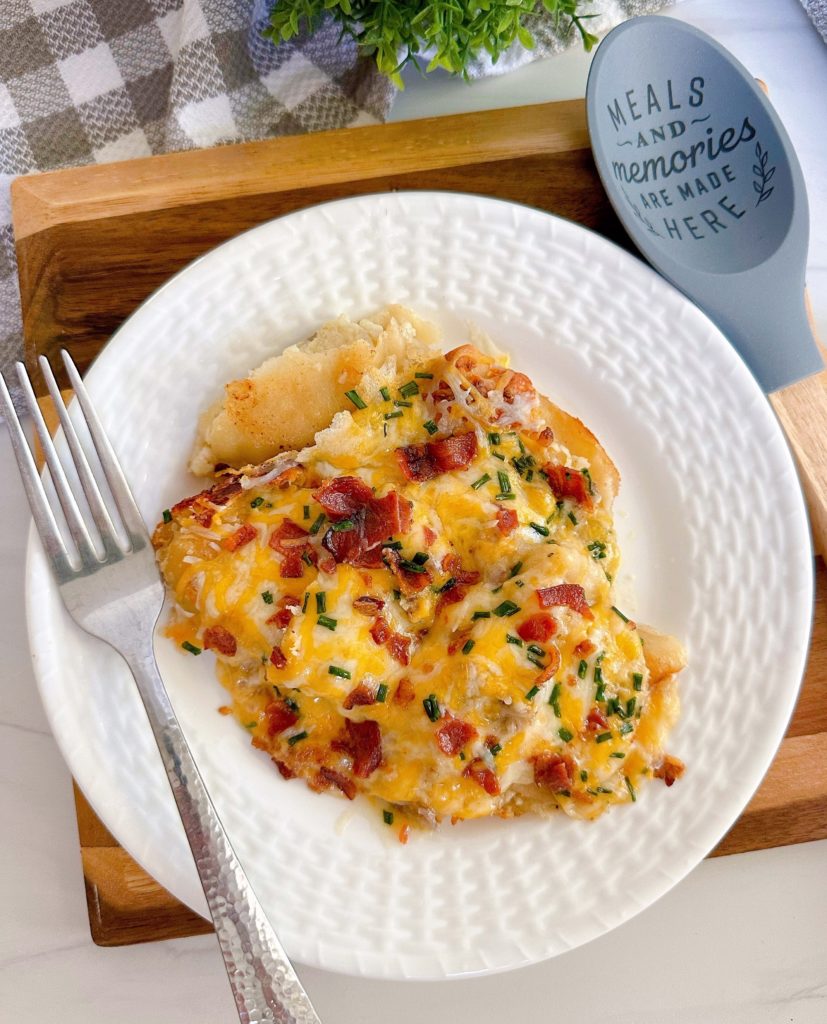 Serving of Pierogi Sausage Casserole on a white dinner plate.