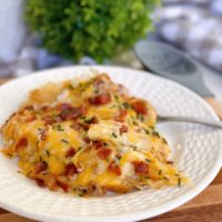 Easy Cheesy Sausage and Pierogi Casserole on a serving plate.