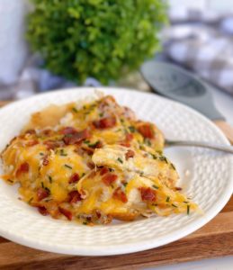 Easy Cheesy Sausage and Pierogi Casserole on a serving plate.