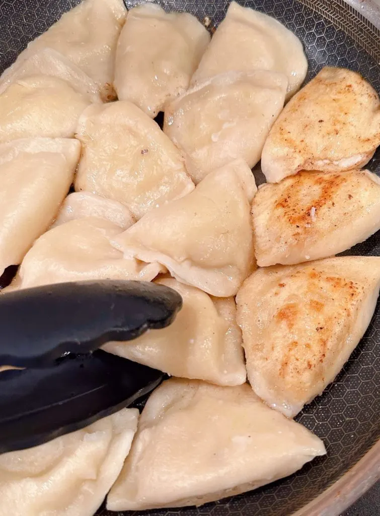 Browning Pierogies in a hot skillet until golden brown.