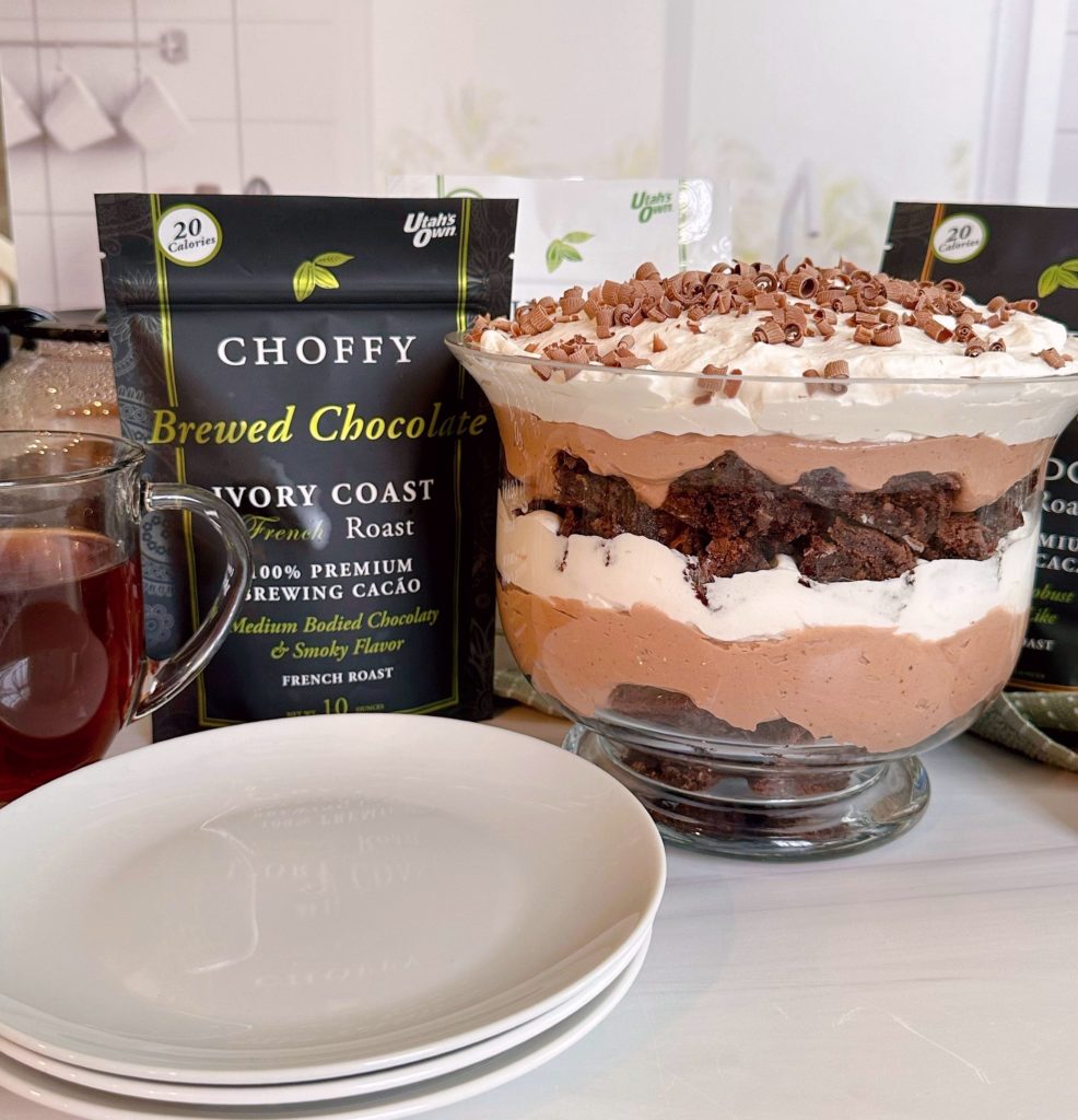 Choffy Chocolate Trifle in a trifle bowl with Choffy in the background.