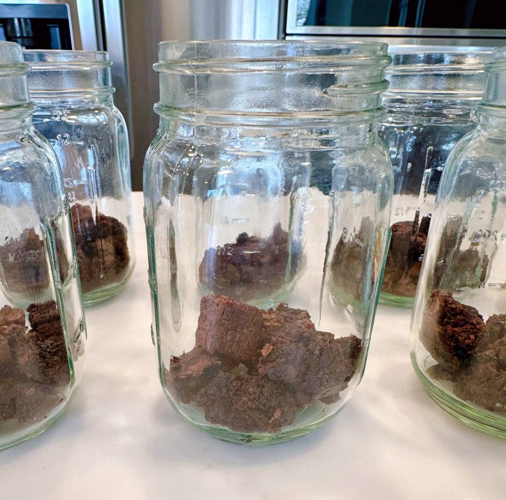 Brownies in the bottom of each pint jar.