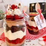 Choffy Black Forest Brownie Trifle dessert in a mason jar.