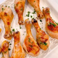 Baked chicken legs with parsley.