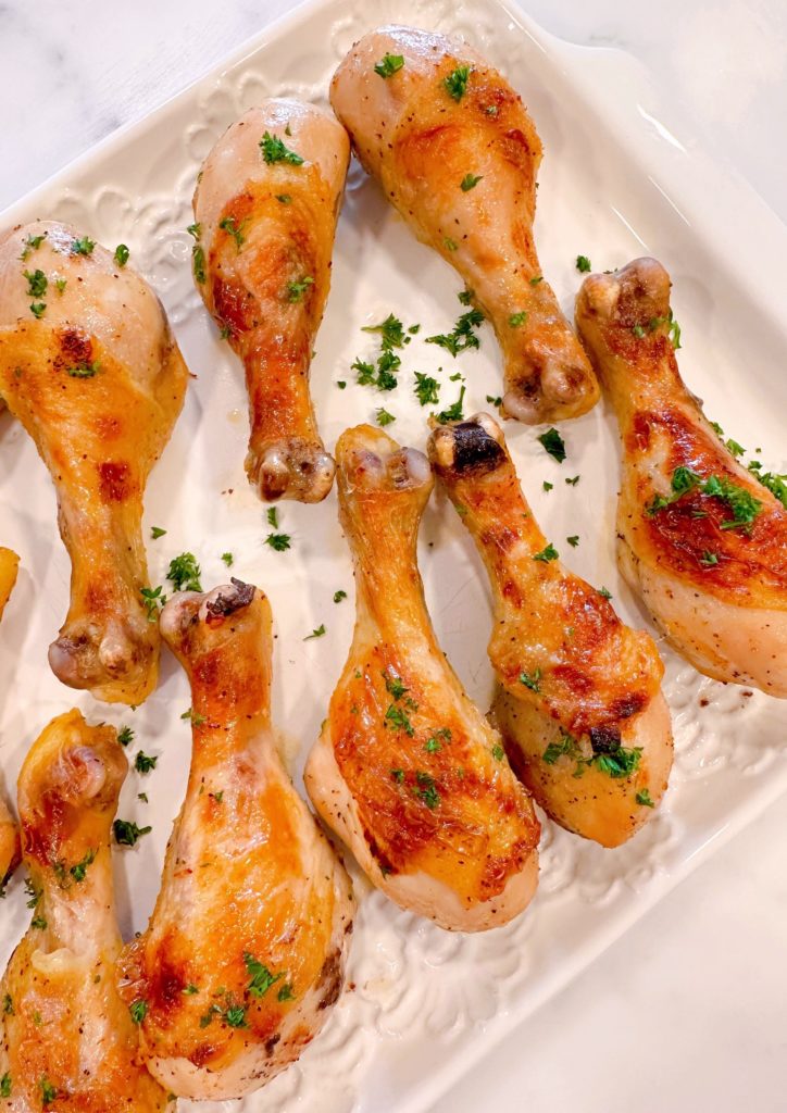 Baked chicken legs with parsley.