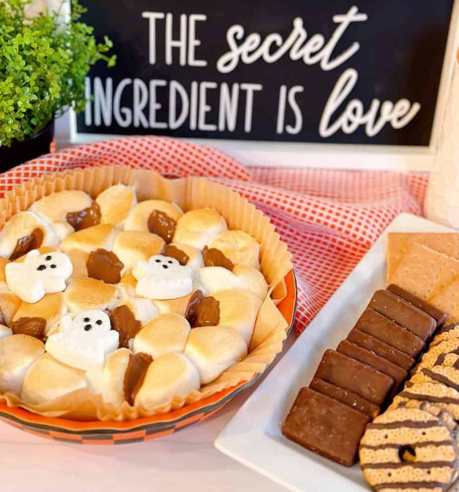 Air Fryer S'mores Dip in a dish with crackers for dipping.