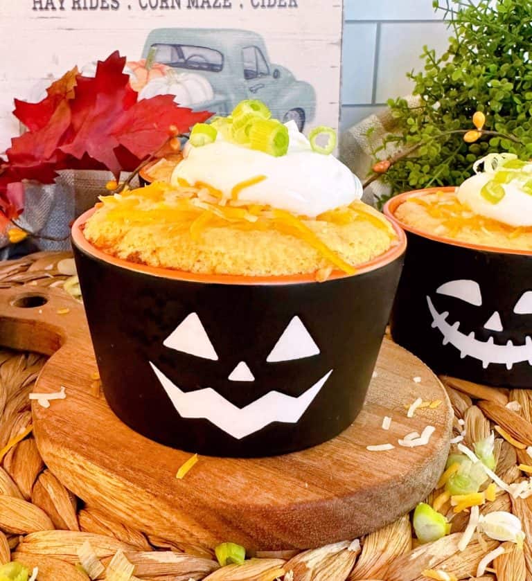 Individual Chili Cornbread cup on a small cutting board.