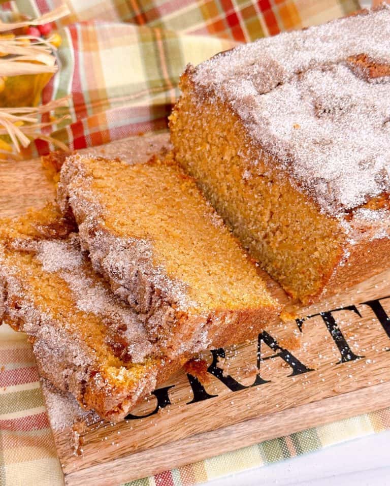 Sweet Potato Cinnamon Bread sliced on a cutting board ready to eat.