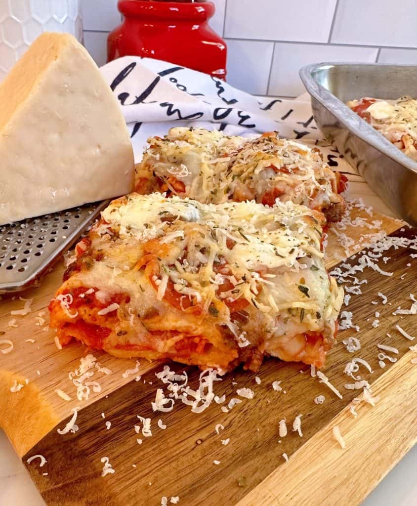 Deep dish hot pocket pizza slices on a cutting board.