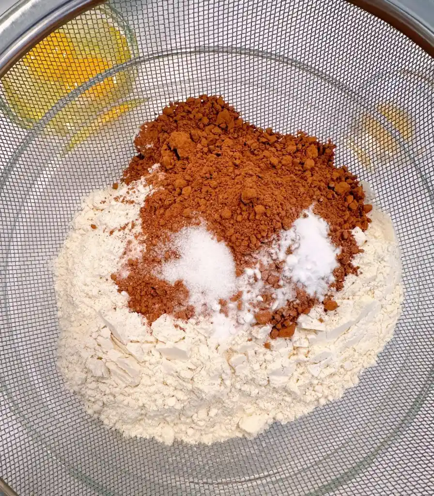 Dry ingredients in a medium-sized bowl for chocolate zucchini cake.