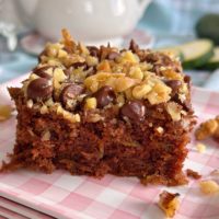 Chocolate Zucchini Walnut Cake square on a plate.