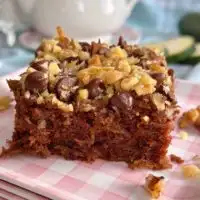 Chocolate Zucchini Walnut Cake square on a plate.