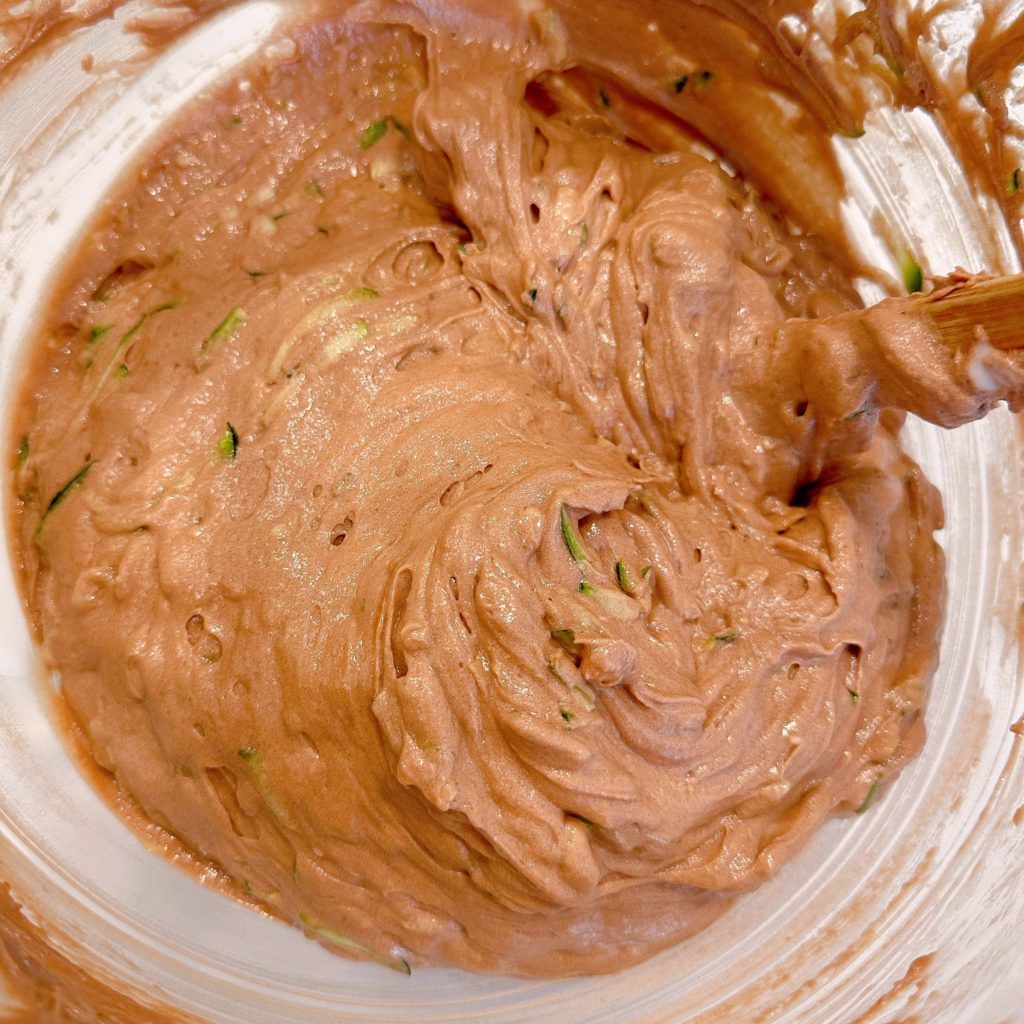 Cake mix with zucchini incorporated.