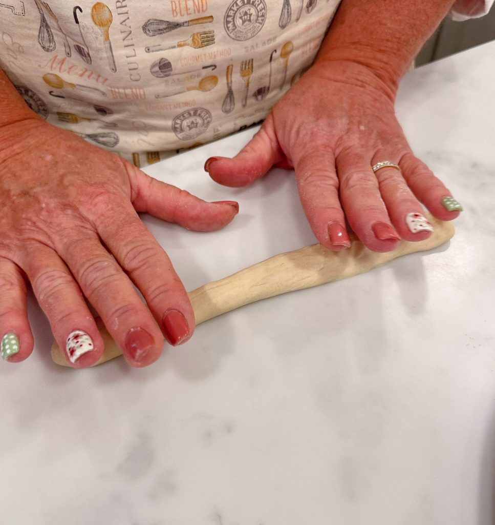 Roll dough balls into breadsticks.