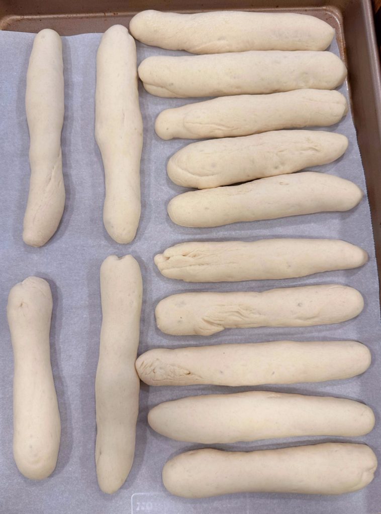 Breadsticks after they have risen.