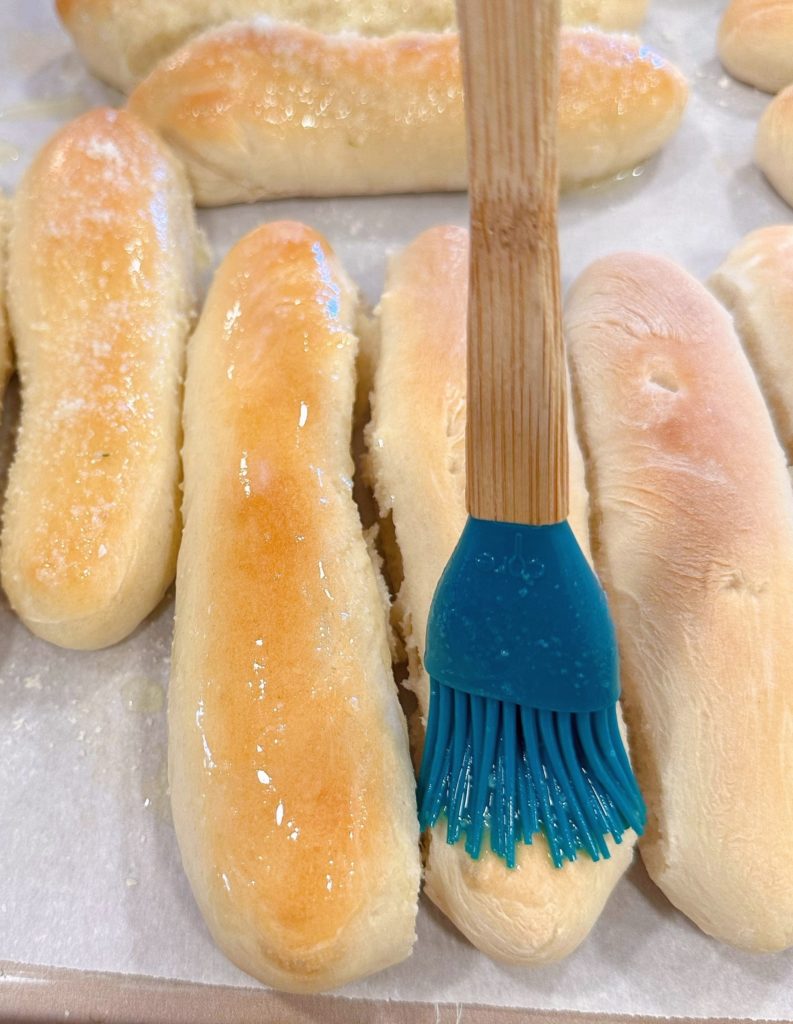 Brush breadsticks with garlic butter.