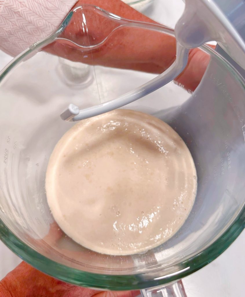 Activated yeast in the mixing bowl.
