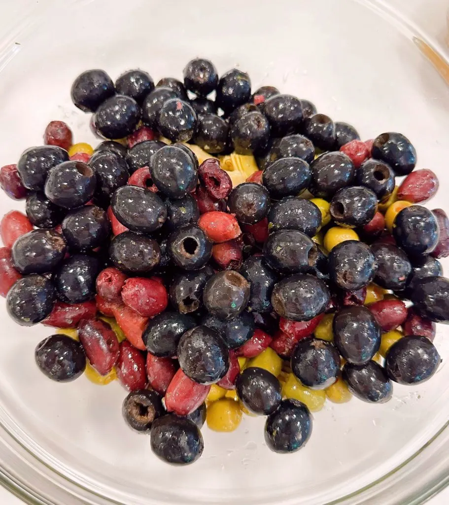 drained olives in a large bowl.