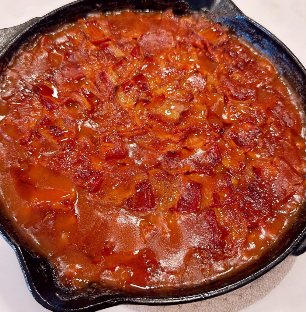 Beans are removed from the oven after baking.