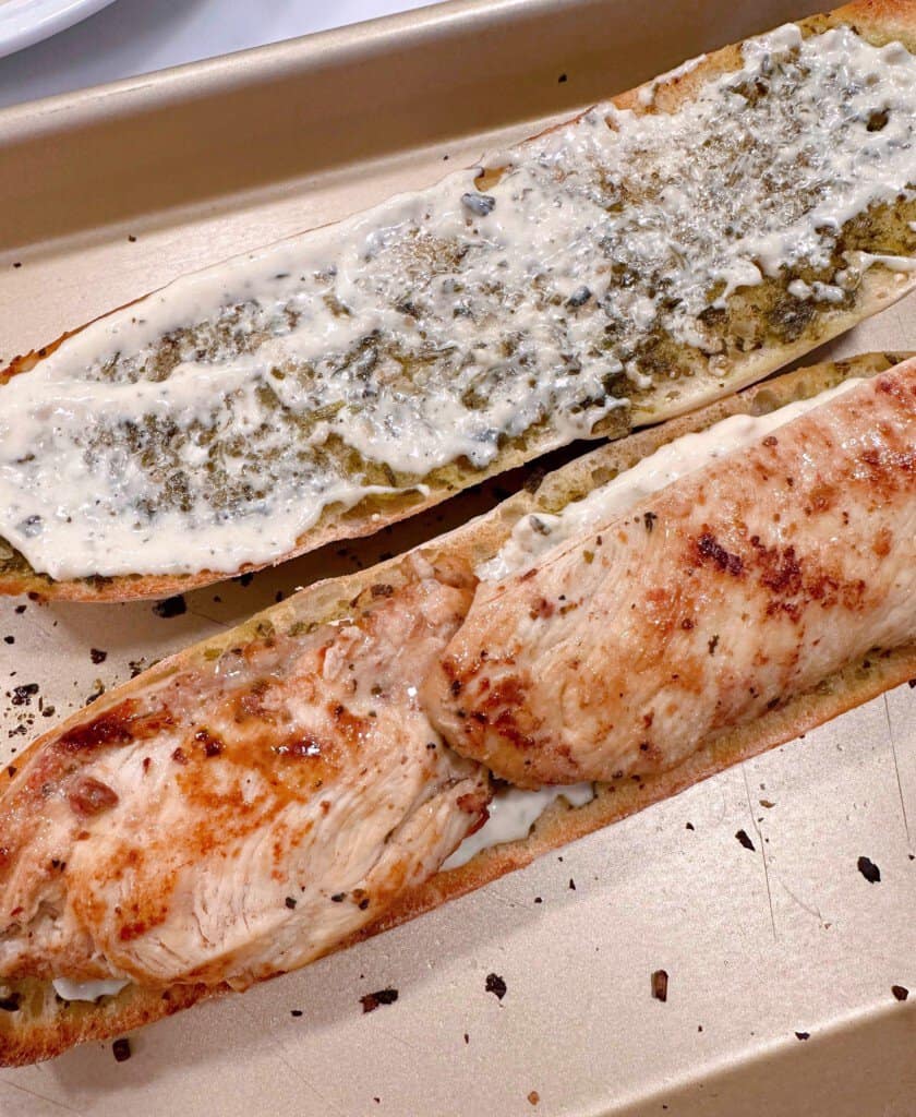 One half of baguette with Caesar dressing.