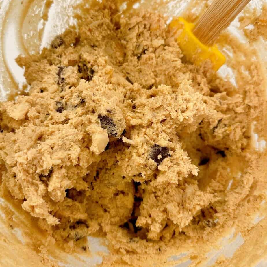 Cookie dough in the mixing bowl with all the ingredients.