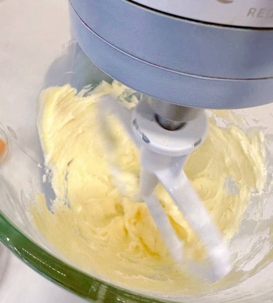 Butter being creamed in mixing bowl.