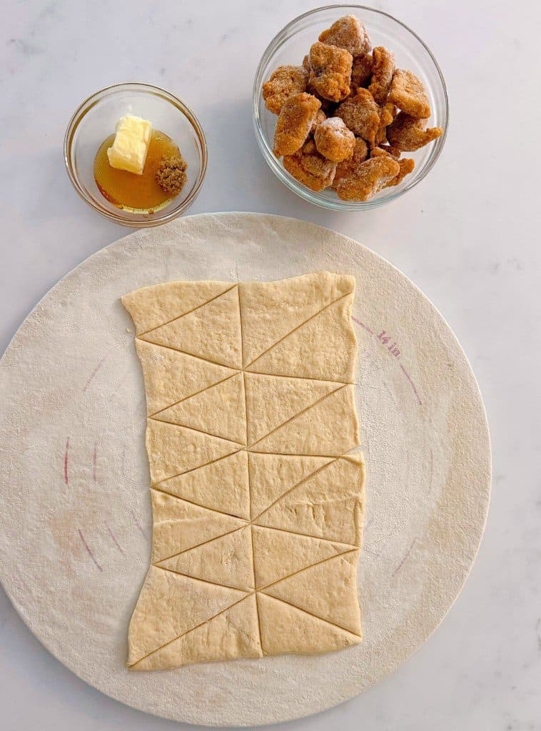 All ingredients gathered together to create chicken nuggets in a blanket.