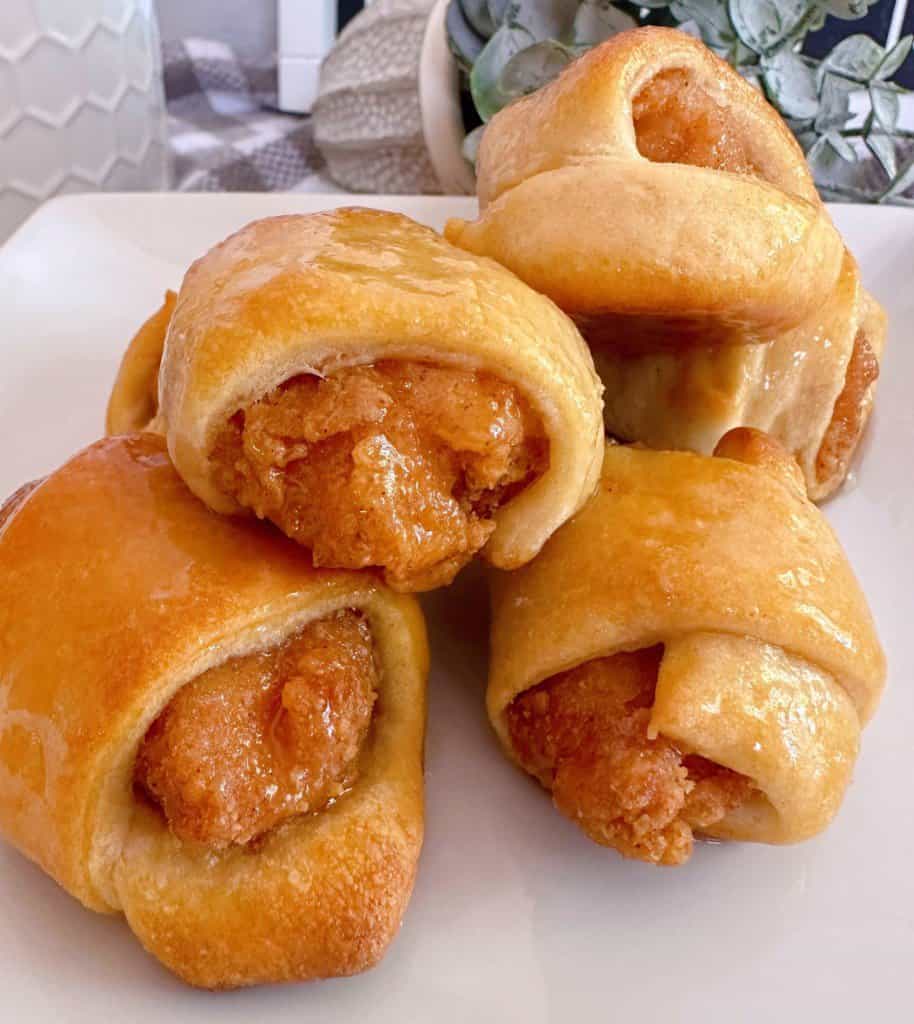 Crescent roll dough wrapped around chicken nuggets.