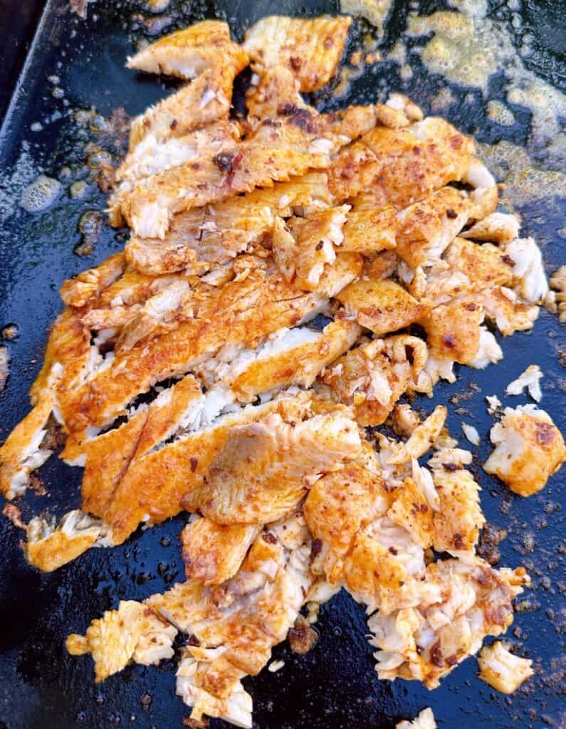 Cooked tilapia on the blackstone griddle.