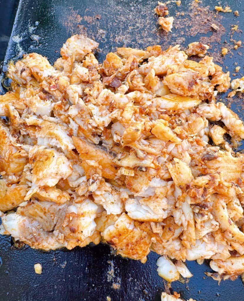 Chopped cooked grilled tilapia.