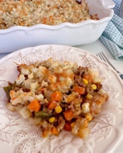 Delicious Layered Beef and Potato Casserole served on a white plate.