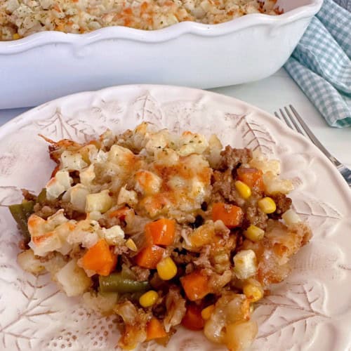 Delicious Layered Beef and Potato Casserole served on a white plate.