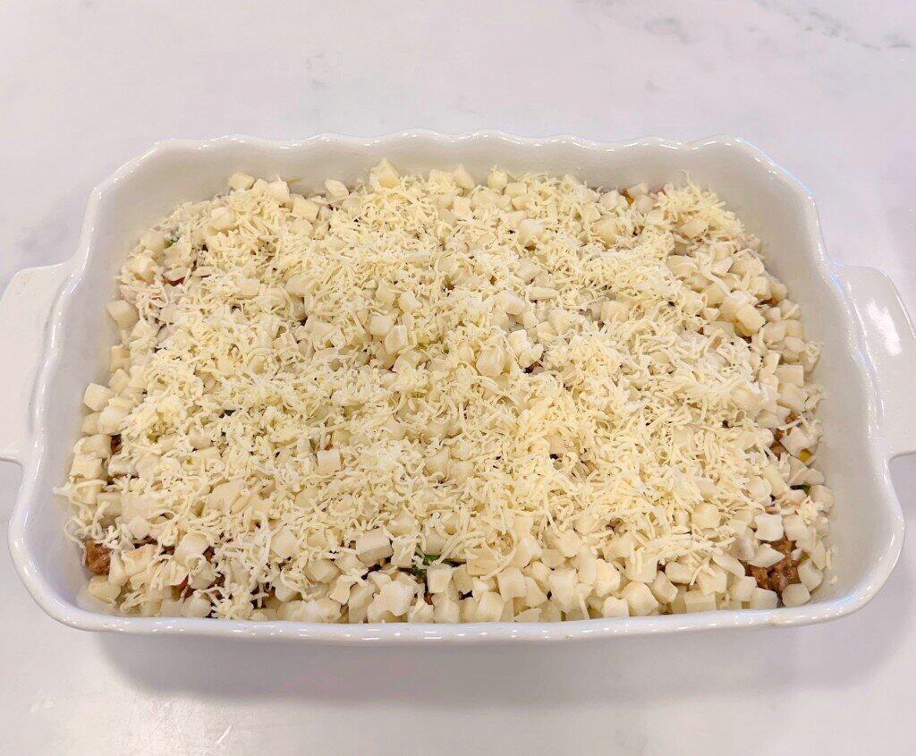 Meat mixture covered with additional potatoes.