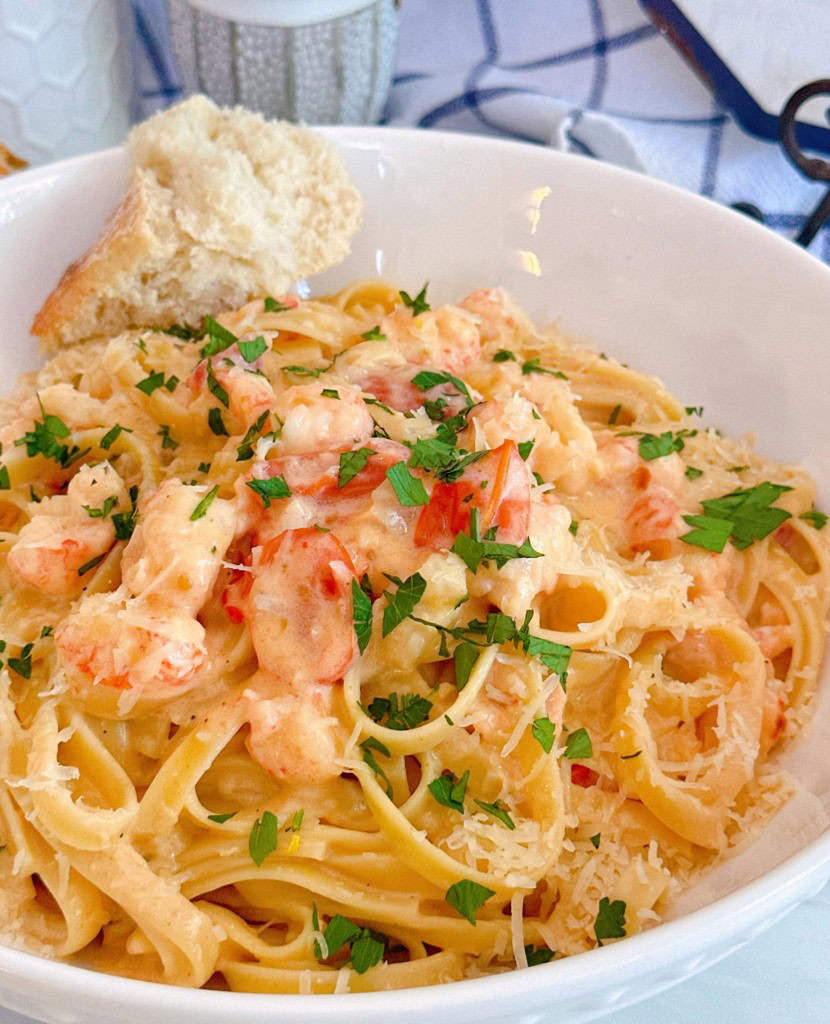 Creamy Lobster Bisque made with premade soup on a bed of pasta.