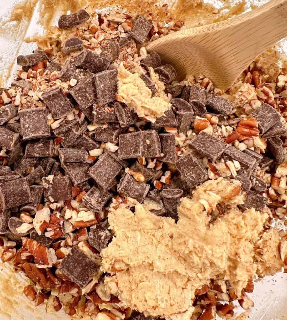 Adding in the chocolate chunks and pecans.
