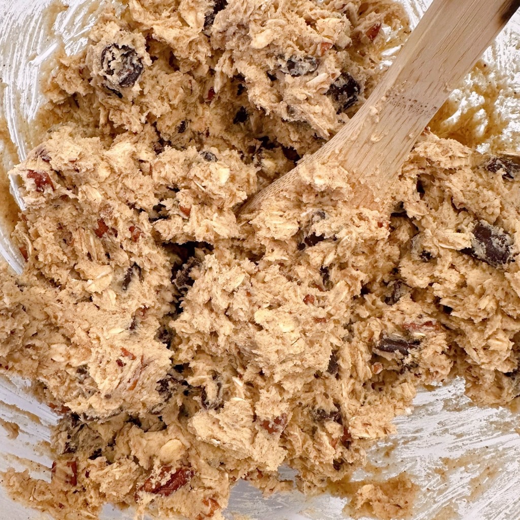 Pumpkin chocolate chunk cookie dough in a mixing bowl.