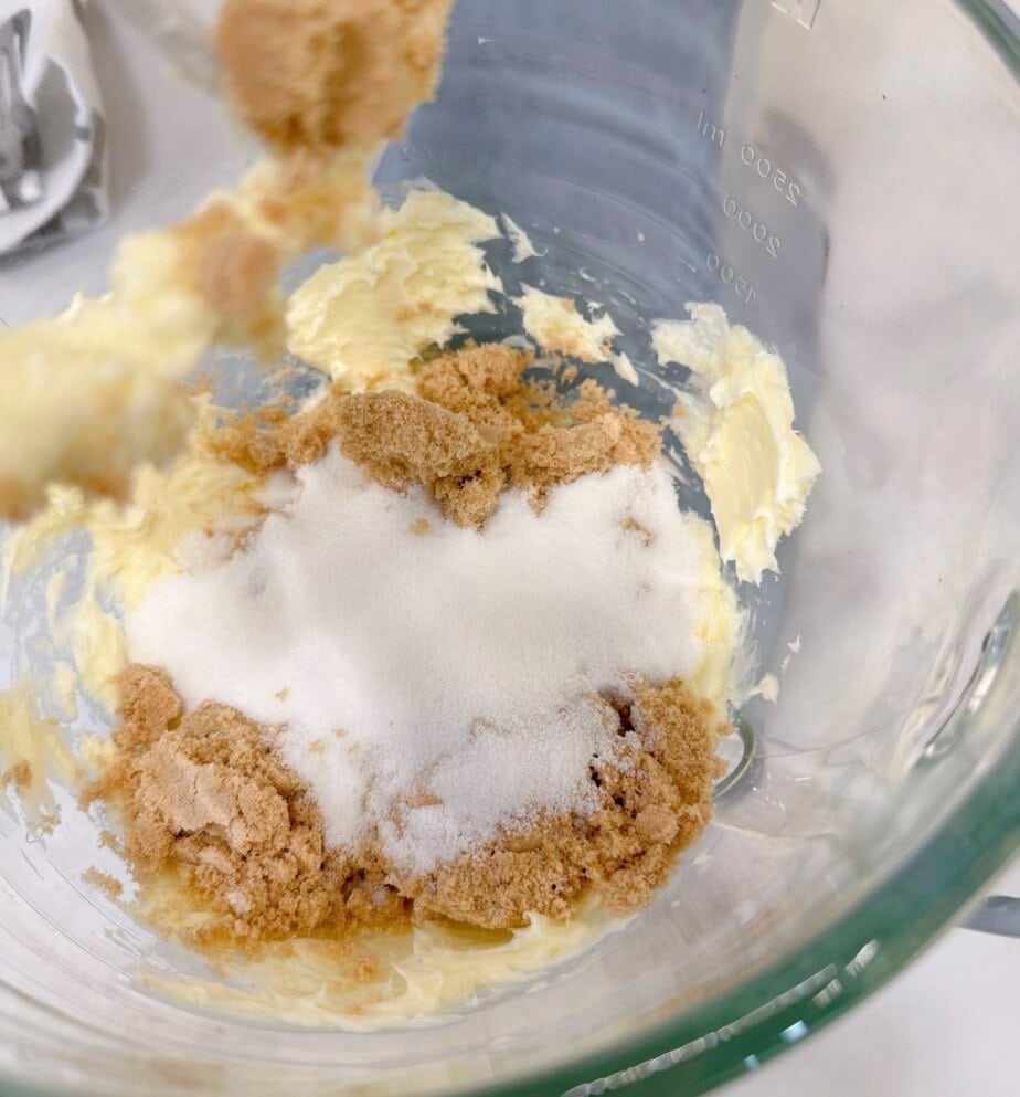 Creaming together brown sugar, white sugar and butter.