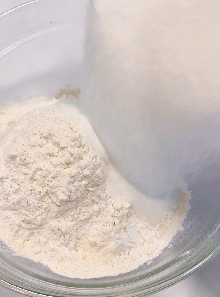 Combine flour and sugar in a bowl.