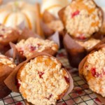 Pumpkin Cranberry Streusel Muffins on a cooling rack.