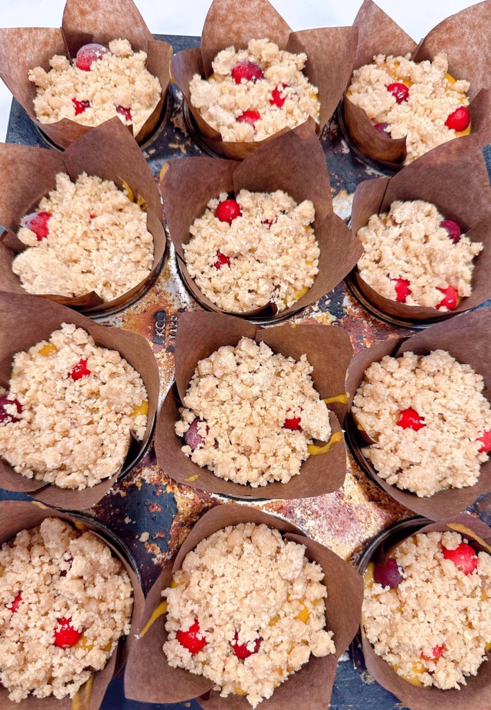 Crumb mixture on top of each muffin.