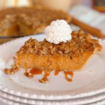 Slice of sweet potato pie with whipped cream.