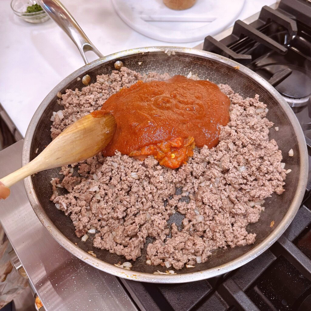 Adding remaining sloppy joe ingredients.
