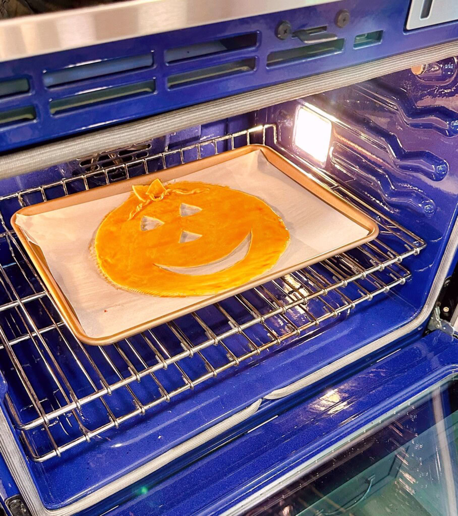 Baking pie face in the oven for sloppy joe pie.