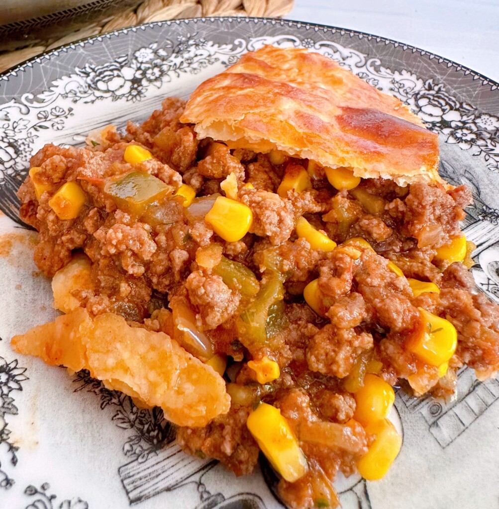 Serving of Sloppy Joe Pie on a serving plate.